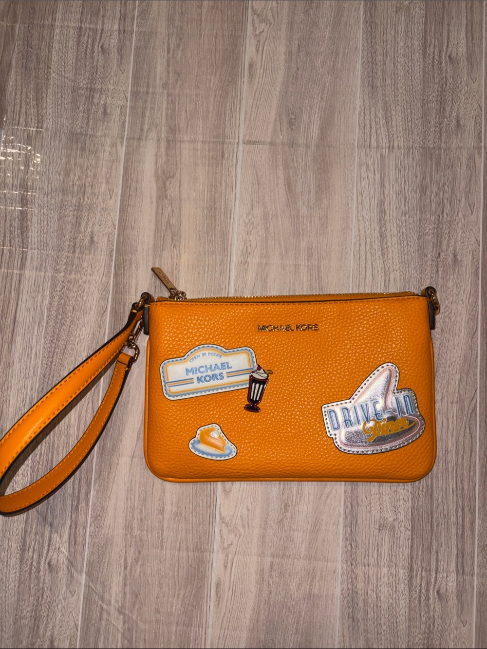 Michael Kors Orange Leather Wristlet with Patch Accents